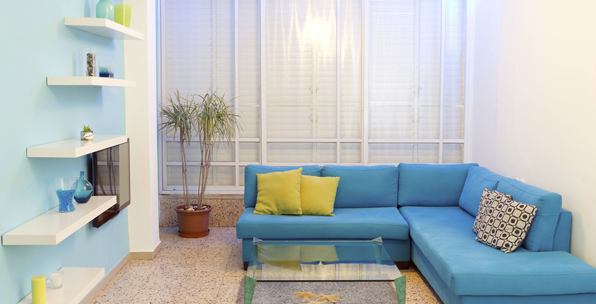 How to add color to a room with sofas?